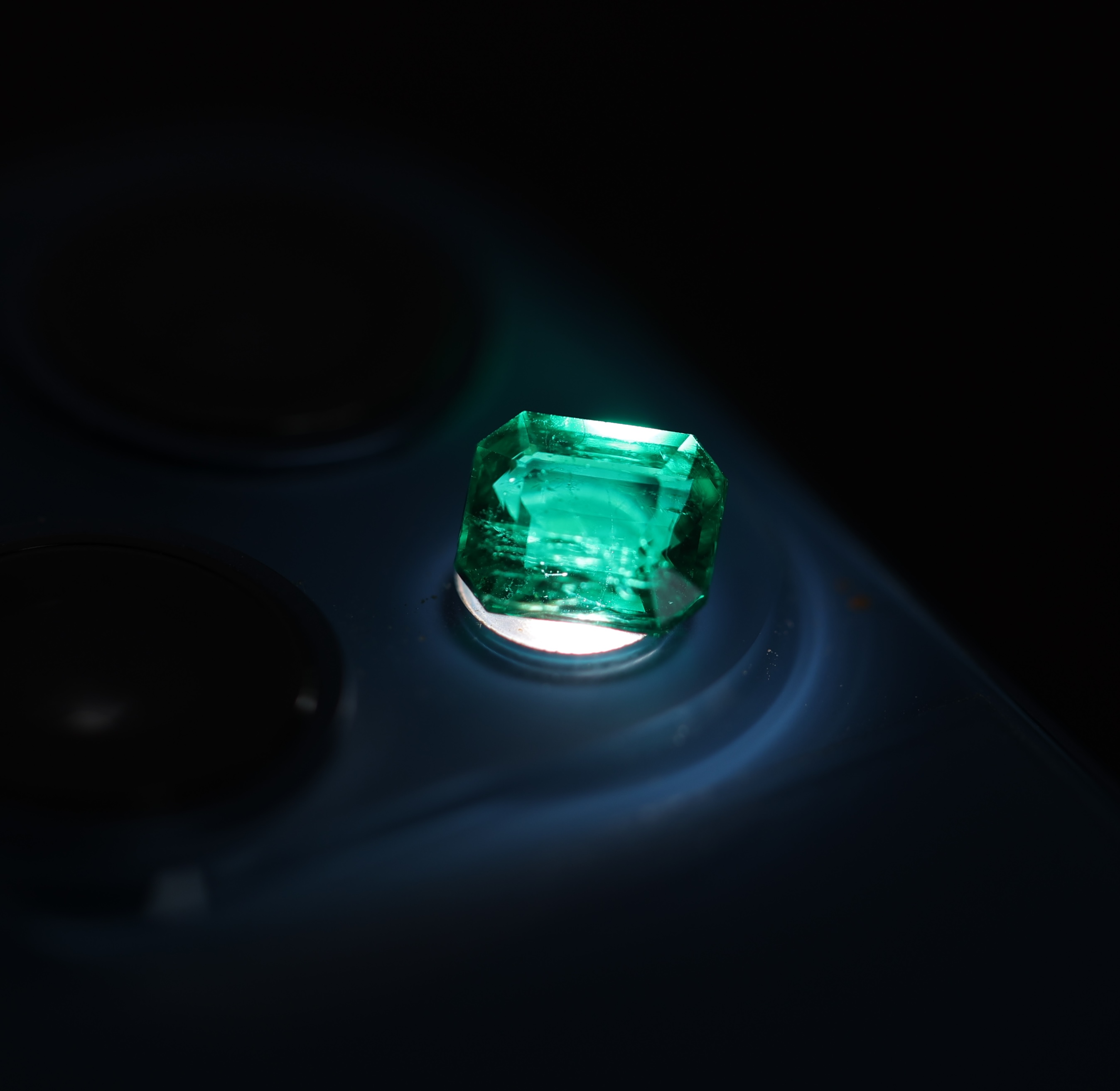 Fire and Brilliance passing through an emerald